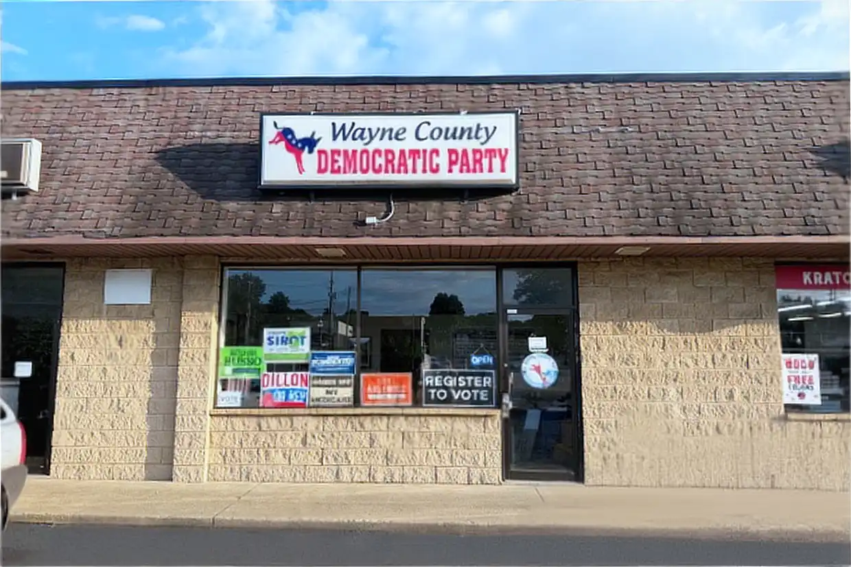 The Wayne County Democratic Party headquarters storefront on East Liberty Street in Wooster, with a Register to Vote sign in the window